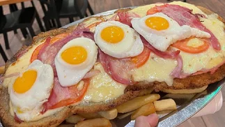 Milanesa napolitana gigante a mitad de precio en más de 100 bodegones porteños