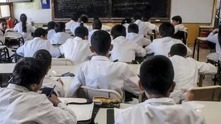 Cuánto cuestan los guardapolvos en 2026 y cómo hacer para gastar menos