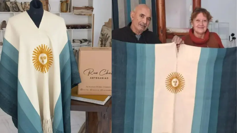 los dueños del taller Rua Charki con el poncho bandera