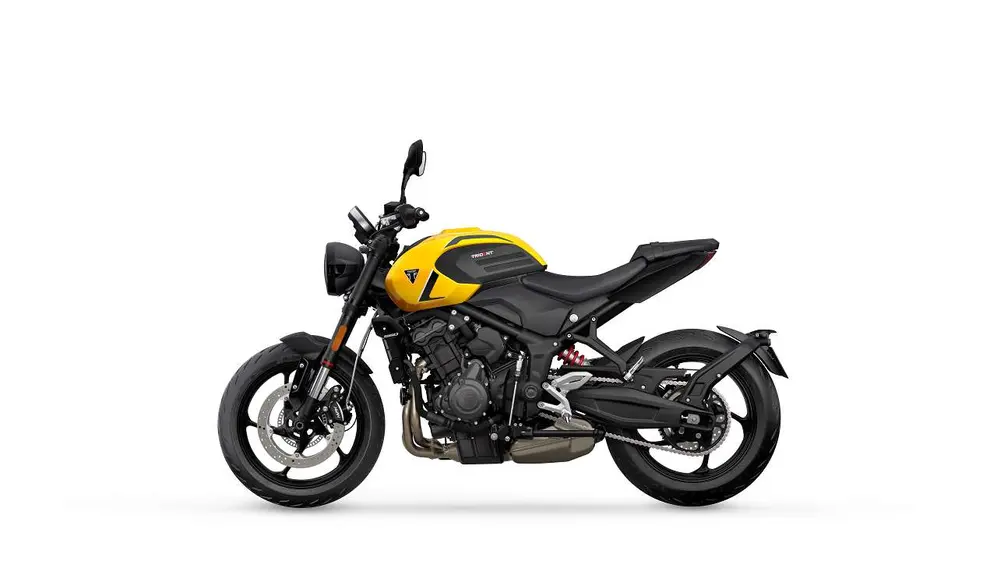 Moto modelo Trident 600 cc,de perfil en color negro y amarillo en fondo blanco
