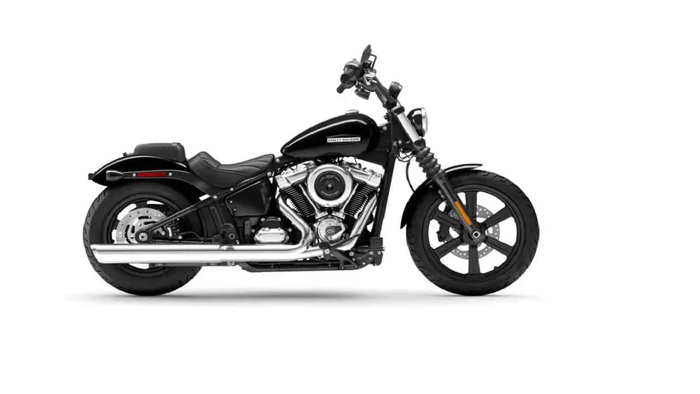 Moto marca Harley Davidson color negra de perfil sobre fondo blanco